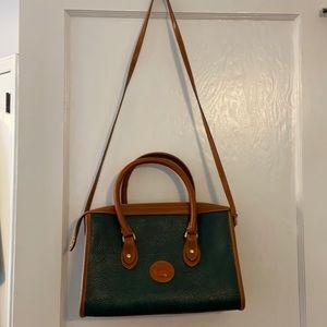 Green classic Dooney & Bourke tote with key ring.